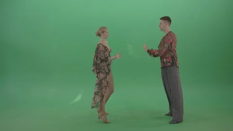 Couple of dancers standing in front of each other moving slowly on green screen Stock Footage 147925758