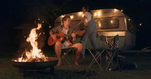 Couple Dancing and Singing Camping Rest Area Stock Footage 229645280