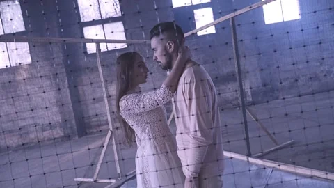 Couple dancing behind the net Stock Footage 133000031