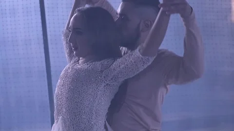 Couple dancing behind the net Stock Footage 141606849