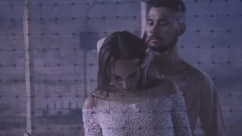 Couple dancing behind the net Stock Footage 147197382