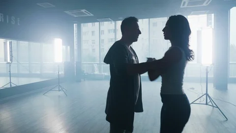 Couple dancing in bright led lights and smoke Stock Footage 107430992