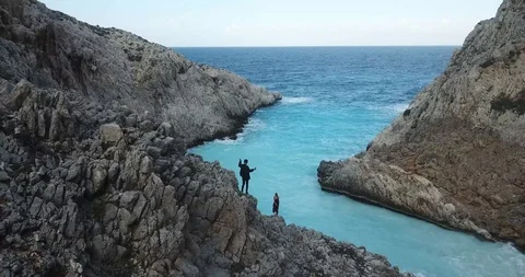 Couple Dancing on Cliff in Greece Drone Shot Stock Footage 106339007