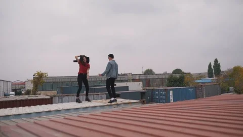 Couple dancing on a freight container Stock Footage 91774002