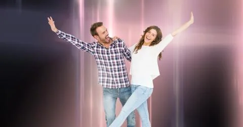 Couple dancing with glowing light streams Stock Photos