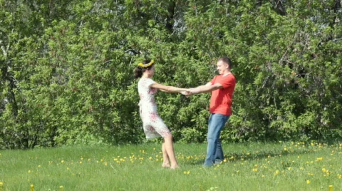 Couple  dancing in green field Stock Footage 715341
