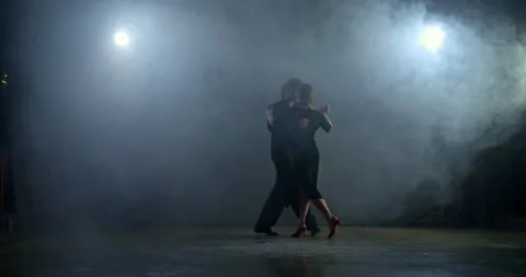 Couple dancing in the hall with smoke, elegant partner circling a beautiful Video stock 146141326