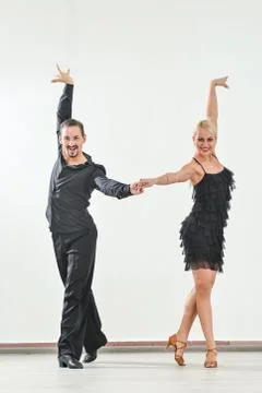 Couple dancing isolated over white background Fotos Stock