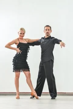 Couple dancing isolated over white background Fotos Stock