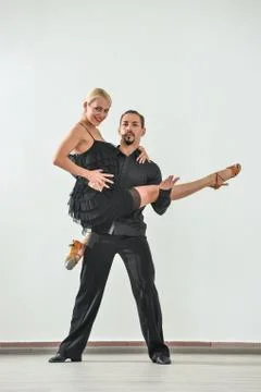 Couple dancing isolated over white background Fotos Stock
