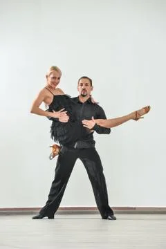 Couple dancing isolated over white background Fotos Stock