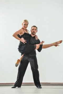 Couple dancing isolated over white background Fotos Stock