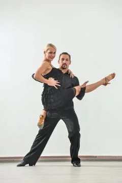 Couple dancing isolated over white background Fotos Stock