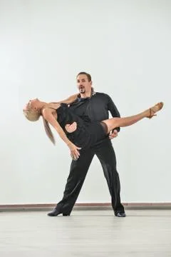 Couple dancing isolated over white background Fotos Stock