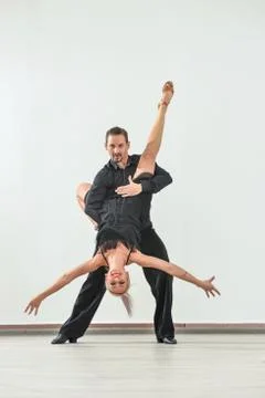 Couple dancing isolated over white background Fotos Stock
