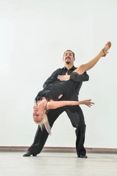 Couple dancing isolated over white background Fotos Stock