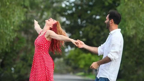 Couple dancing in the park Stock Photos
