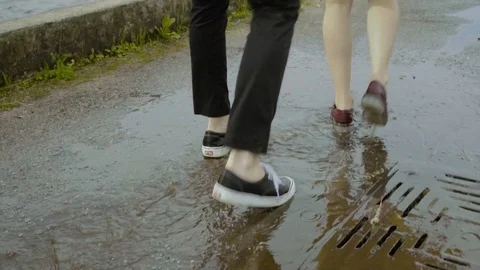 Couple dancing rock-n-roll dance on the puddle. Happy man and woman Stock Footage 80671855