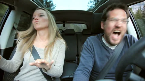 Couple dancing serious in car in the mountain Vidéo 42401488