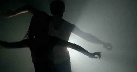 Couple dancing in silhouettes Stock Footage 150294456