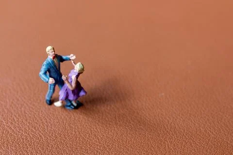 Couple dancing on a smooth brown background Foto stock