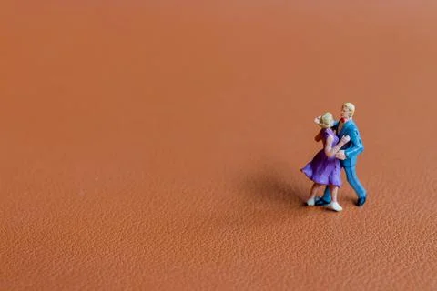 Couple dancing on a smooth brown background Foto stock
