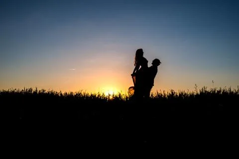 Couple dancing in the sunset Stock Photos
