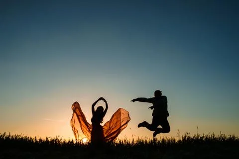 Couple dancing in the sunset Stock Photos