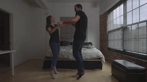Couple dancing in their bedroom Stock Footage 70808362