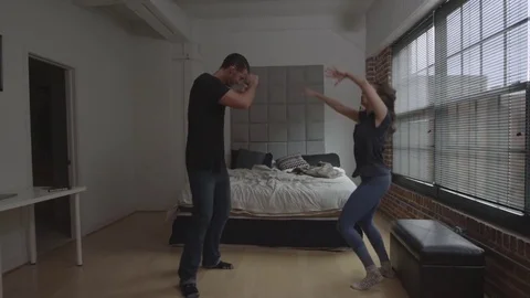 Couple dancing in their bedroom Stock Footage