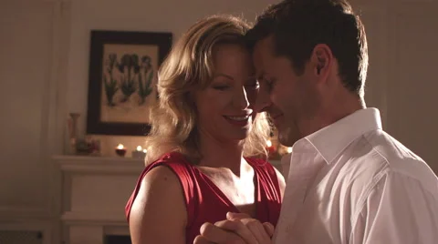 Couple dancing in their home in the evening. Stock Footage 43660765