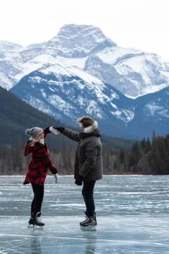 Couple dancing while standing in snowy landscape Stock Photos