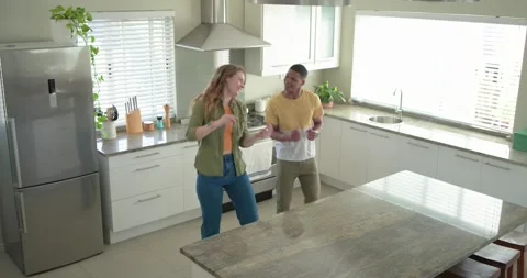 Couple dancing while talking, woman leading steps as man mirroring near island Stock Footage 341089913