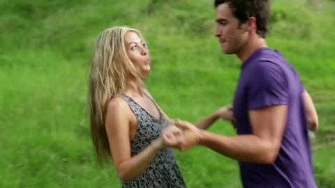 Couple dancing in woodland Stock Footage