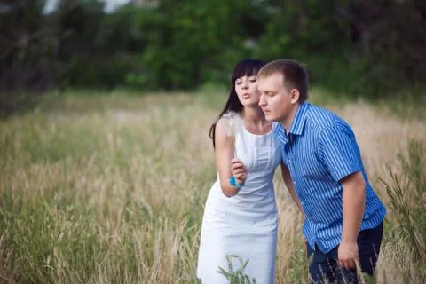 Couple with dandelion Stock Photos
