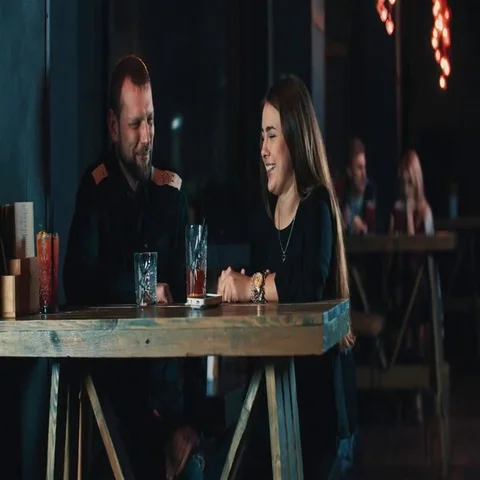 Couple date at bar 4k video. Young woman man with beverage talking Stock Footage 69376931