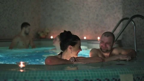 Couple on a date at the beautiful swimming pool in the sauna Stock Footage 73673789