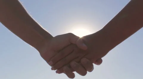 Couple on a date holding hands solar flare Stock Footage 68318921