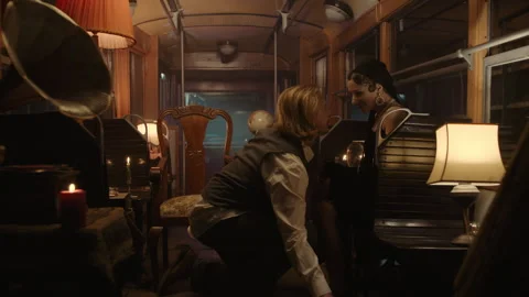 A couple on a date in an old tram and man kneeling before a woman Vidéo 259577196