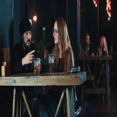 Couple in date talking at bar 4k video. Woman man laughing, smiling and flirt Stock Footage 69376752