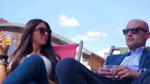 Couple on the date. They are talking and drinking juice. Video stock 67628826