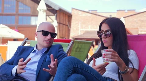 Couple on the date. They are talking and drinking juice. Stock Footage 67628976