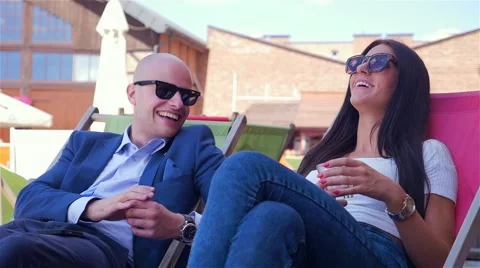 Couple on the date. They are talking and drinking juice. Stock Footage 67628978