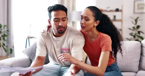 Couple, debt and documents or finance problem on home couch arguing about bills Stock Footage 237769048