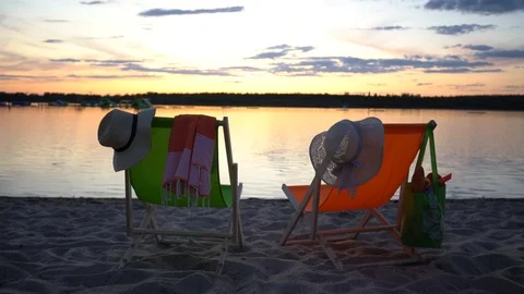Couple of deck chairs on empty sea beach Stock Footage 120678158