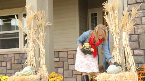 Couple decorates porch in Fall Video stock 61671632