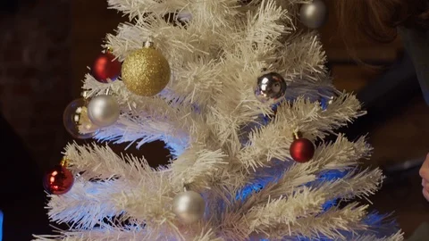Couple decorating christmas tree Stock Footage 125339818