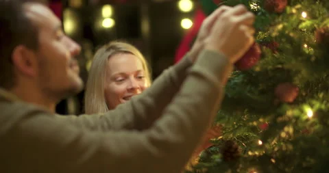 Couple decorating christmas tree Stock Footage 143780608