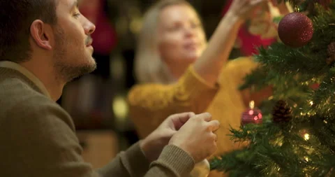 Couple decorating christmas tree Stock Footage 143780885