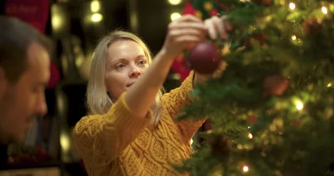 Couple decorating christmas tree Stock Footage 143781433